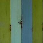 wooden doors secured with a padlock